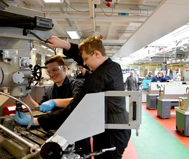 Two students in a workshop